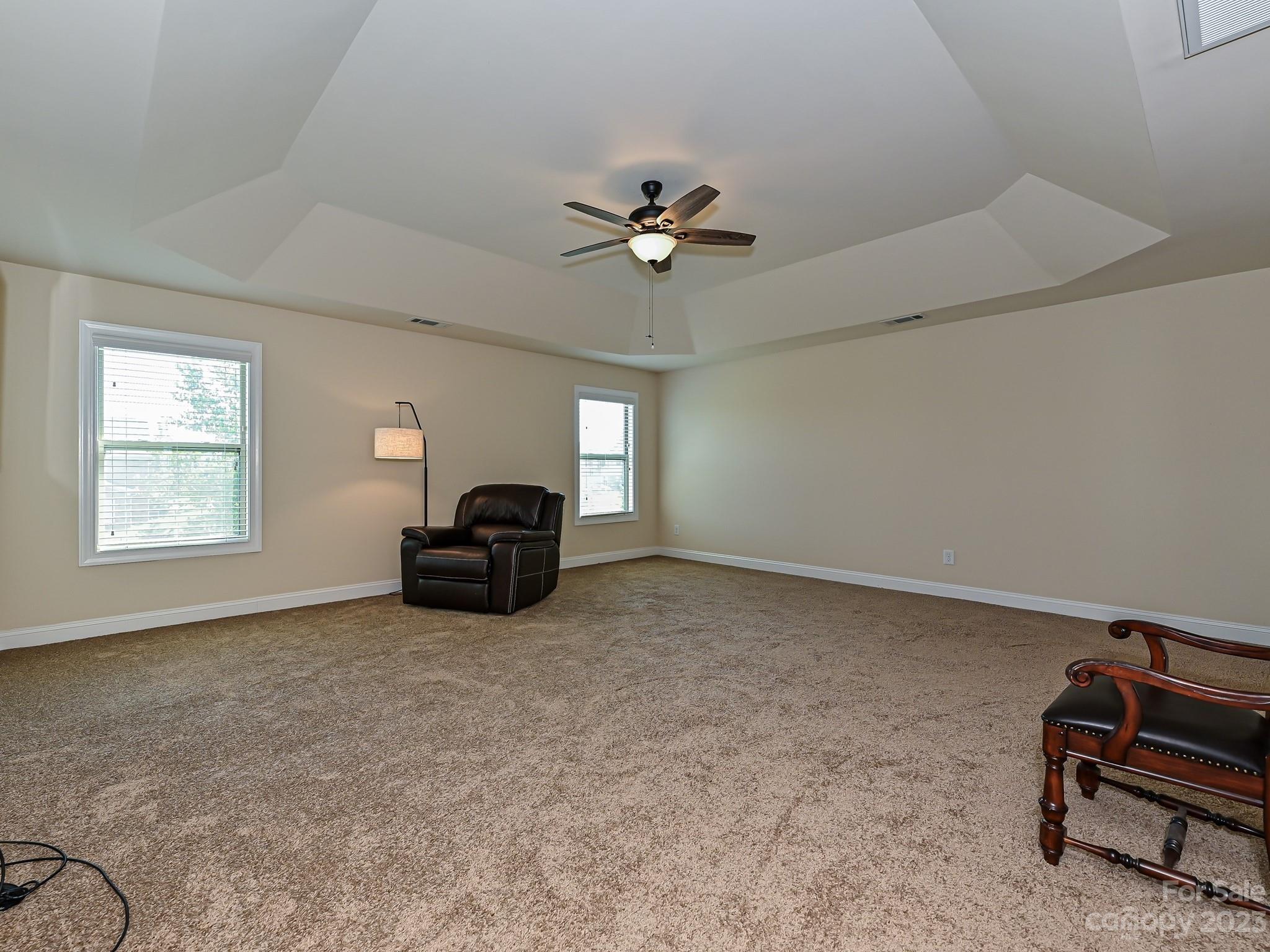 1012 Thorndale Road Indian Trail, NC 28079 - Photo 21 of 36 a living room with furniture and a ceiling fan