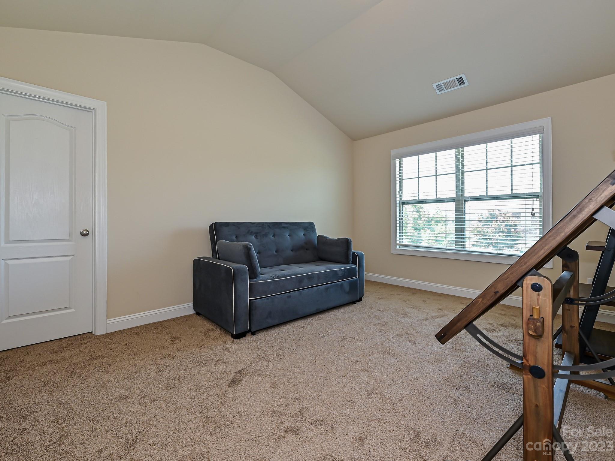 1012 Thorndale Road Indian Trail, NC 28079 - Photo 27 of 36 a living room with furniture and stairs