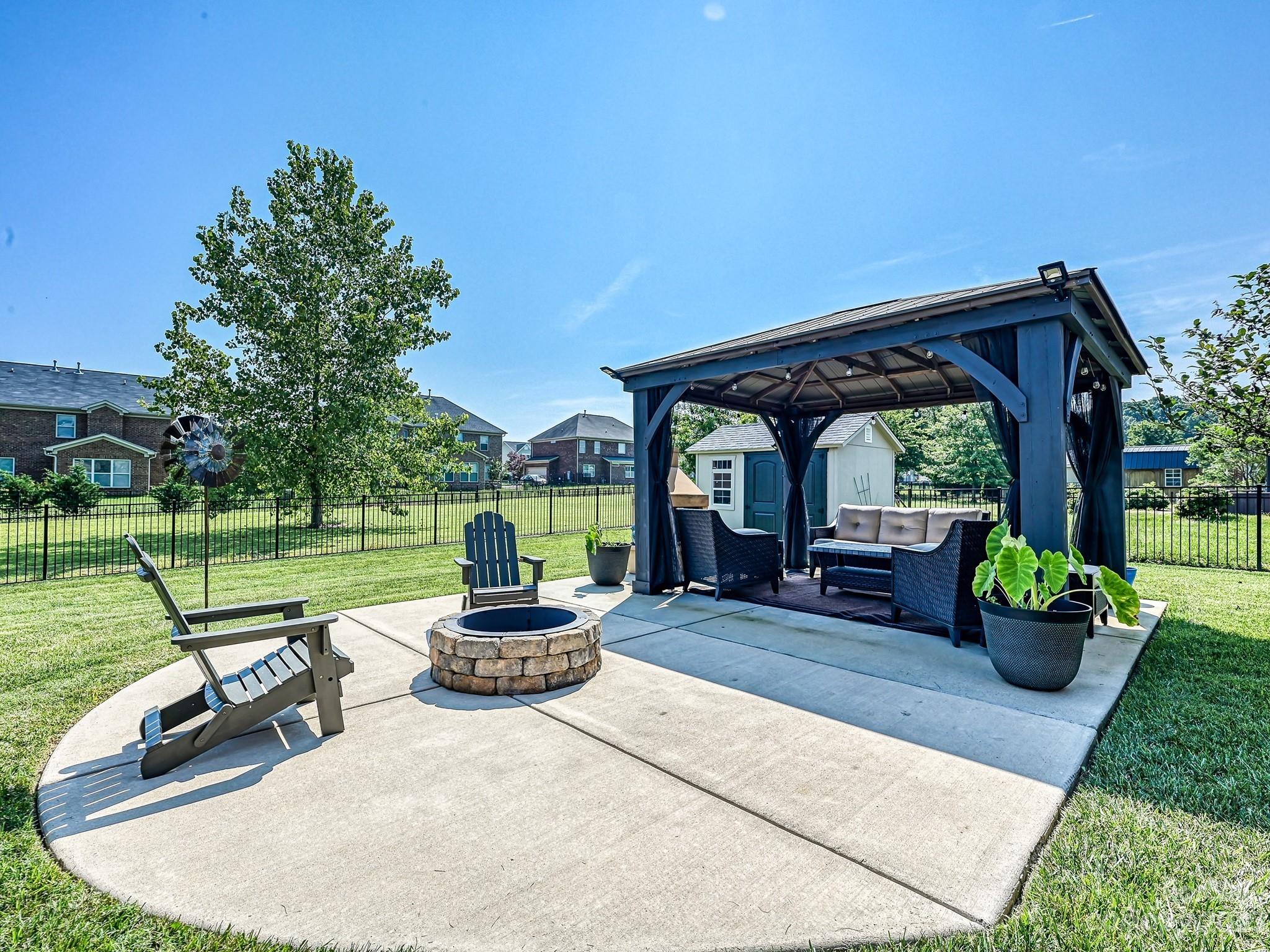 1012 Thorndale Road Indian Trail, NC 28079 - Photo 31 of 36 a front view of a house with garden and patio