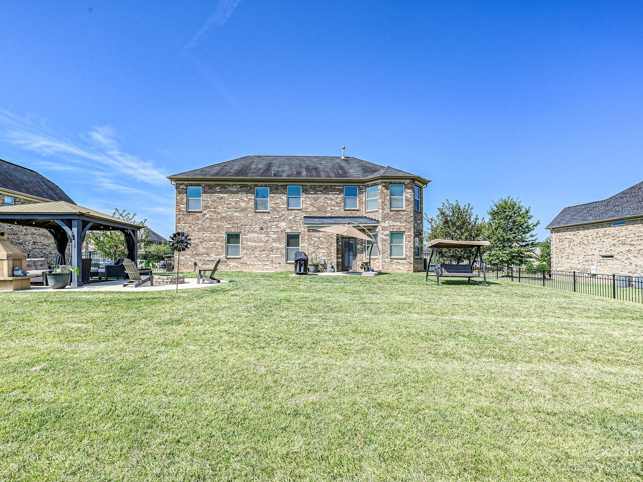 1012 Thorndale Road Indian Trail, NC 28079 - Photo 33 of 36 a view of a house with backyard and garden
