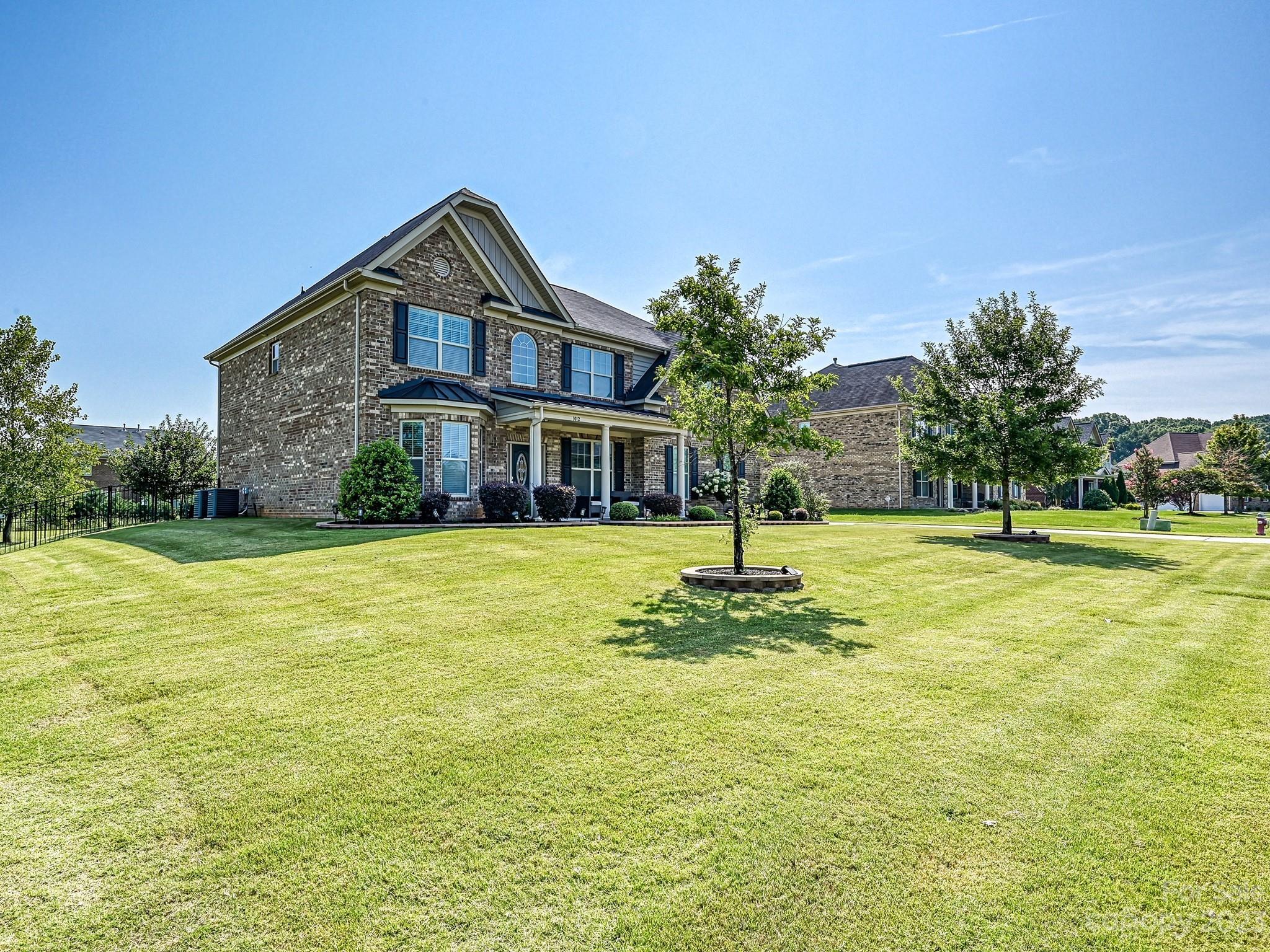 1012 Thorndale Road Indian Trail, NC 28079 - Photo 34 of 36 a house view with swimming pool in front of it
