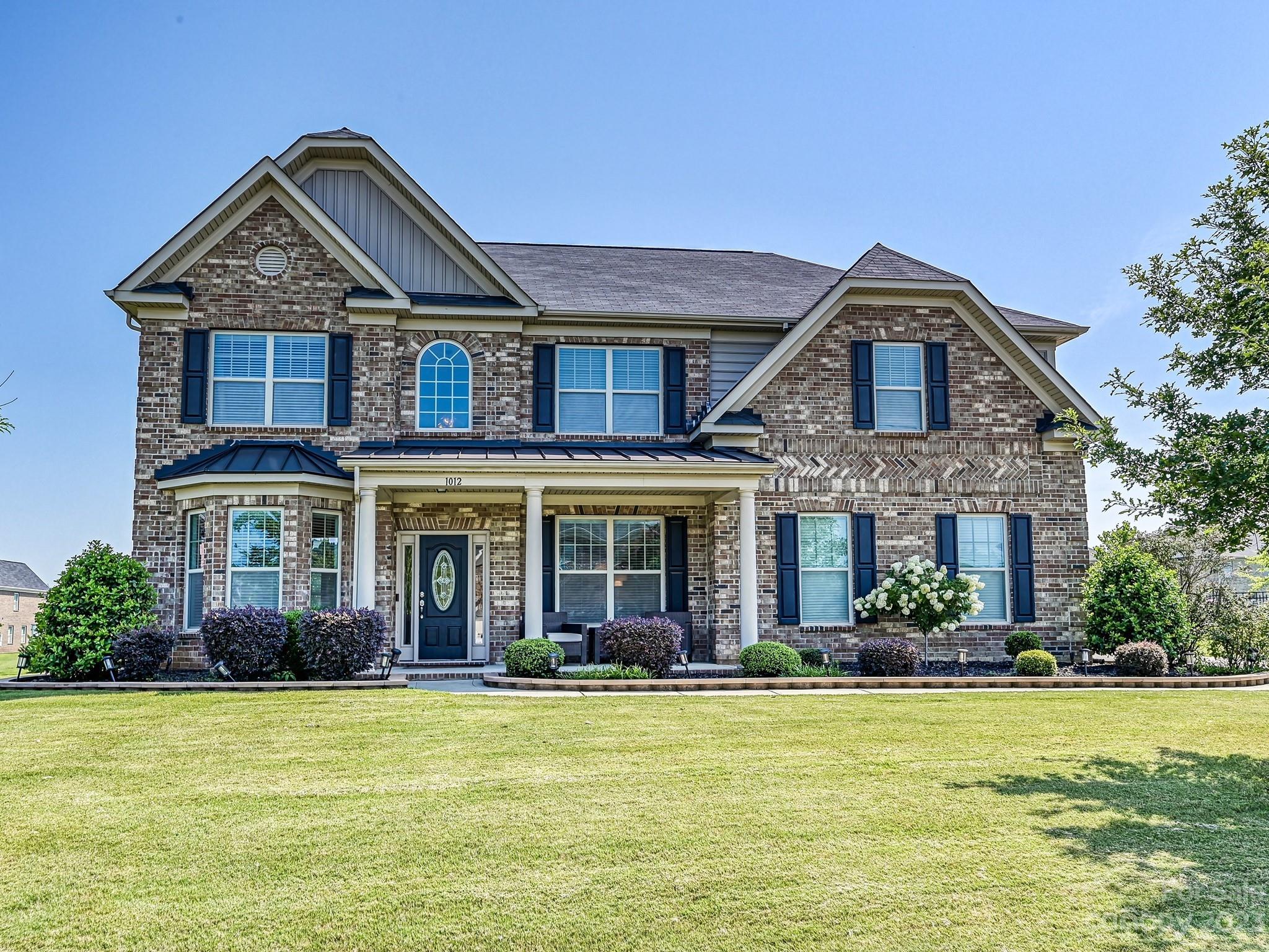 1012 Thorndale Road Indian Trail, NC 28079 - Photo 36 of 36 a front view of a house with garden