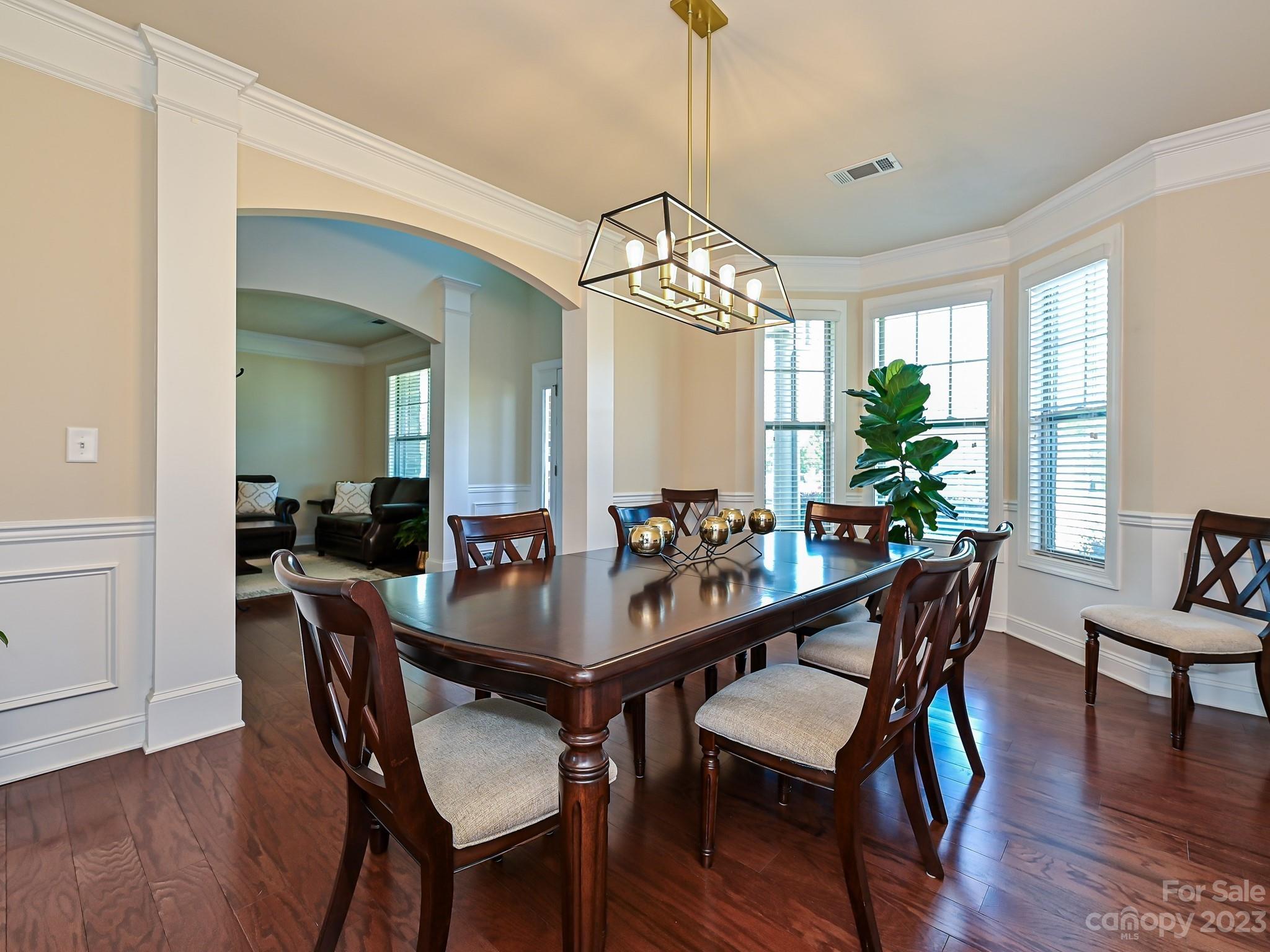 1012 Thorndale Road Indian Trail, NC 28079 - Photo 5 of 36 a view of a dining room with furniture window and wooden floor