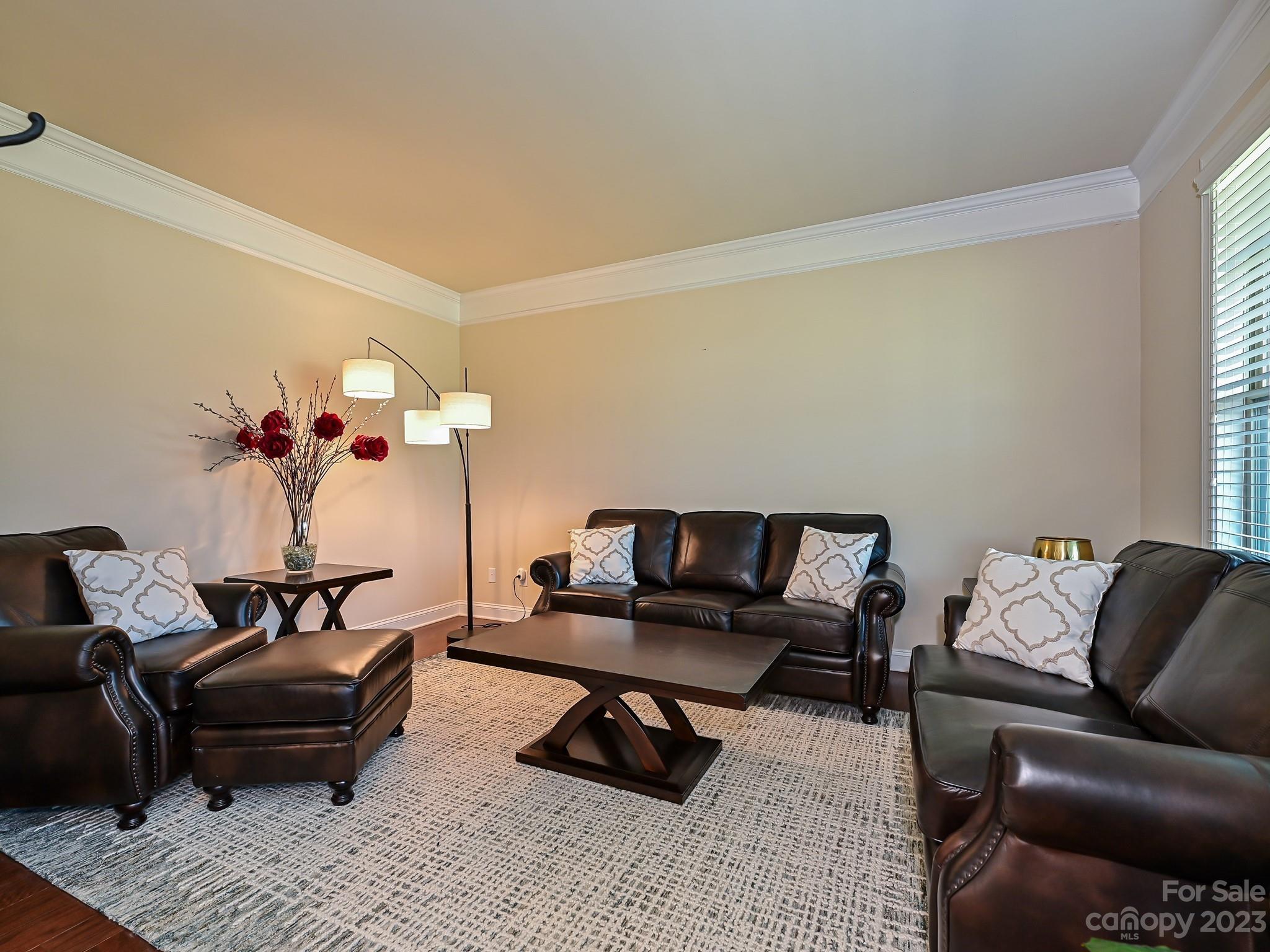1012 Thorndale Road Indian Trail, NC 28079 - Photo 7 of 36 a living room with furniture and flowers