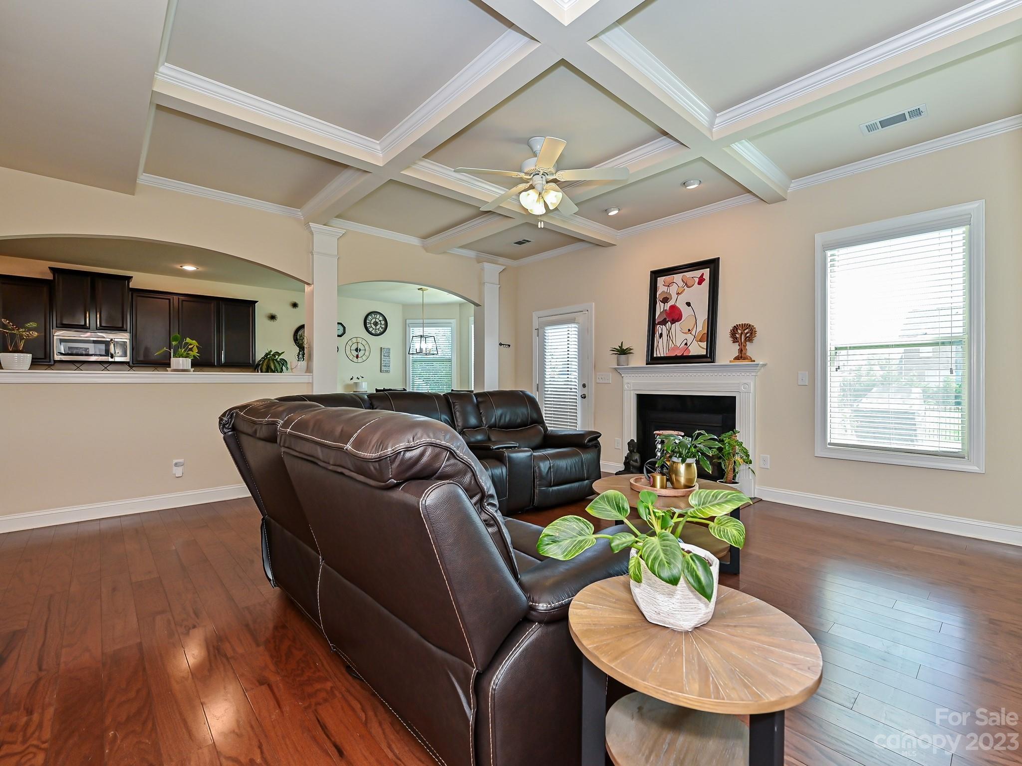 1012 Thorndale Road Indian Trail, NC 28079 - Photo 8 of 36 a living room with fireplace furniture and a wooden floor