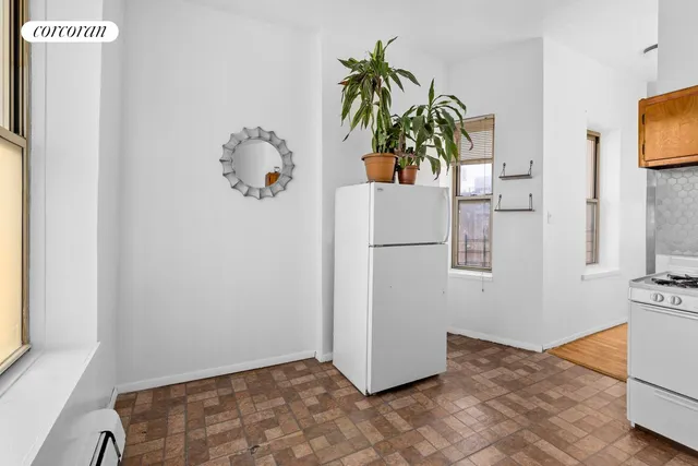 a utility room with cabinets washer and dryer
