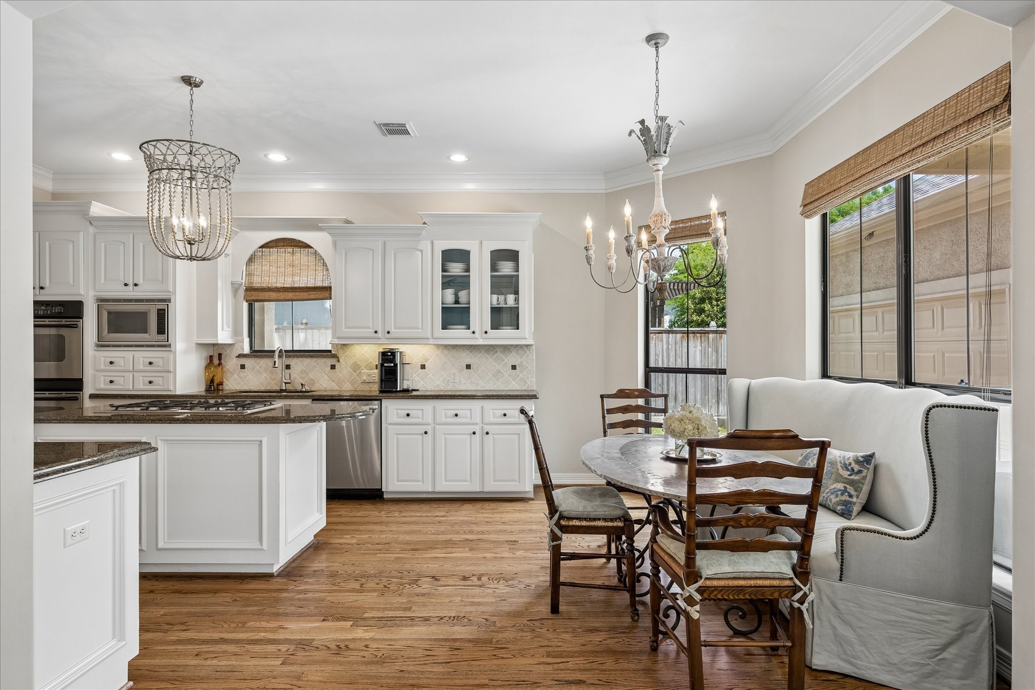 802 Anderson Street Bellaire, TX 77401 - Photo 13 of 36 View to the breakfast room and kitchen with abundant light and lots of room to gather.