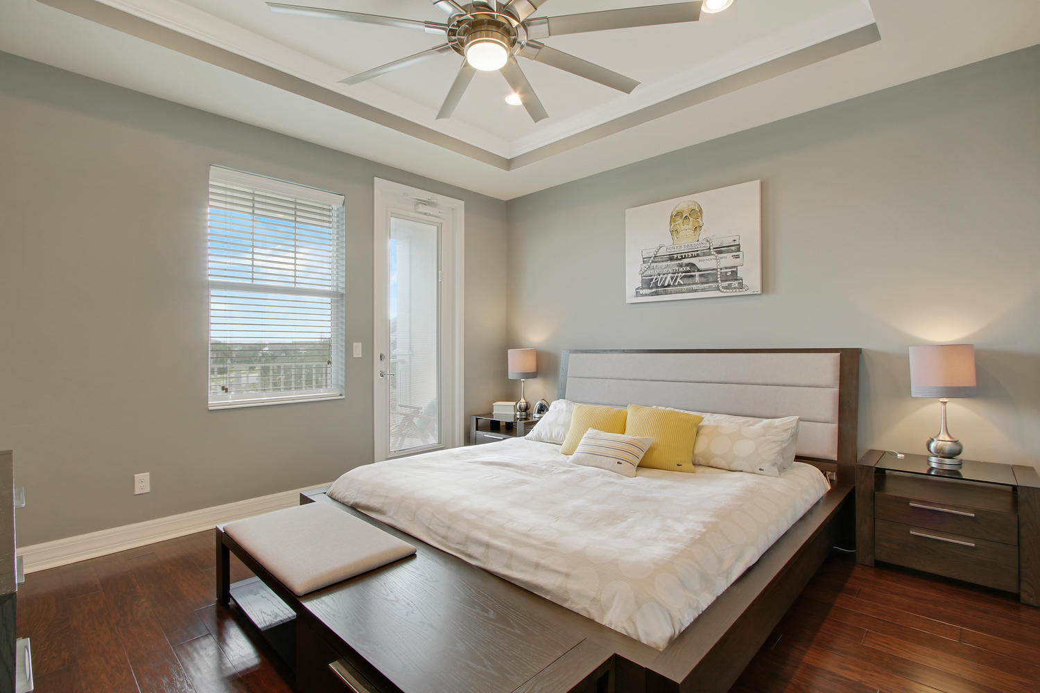 2706 Avalon Way Jupiter, FL 33458 - Photo 12 of 28 a bedroom with a bed and a chandelier