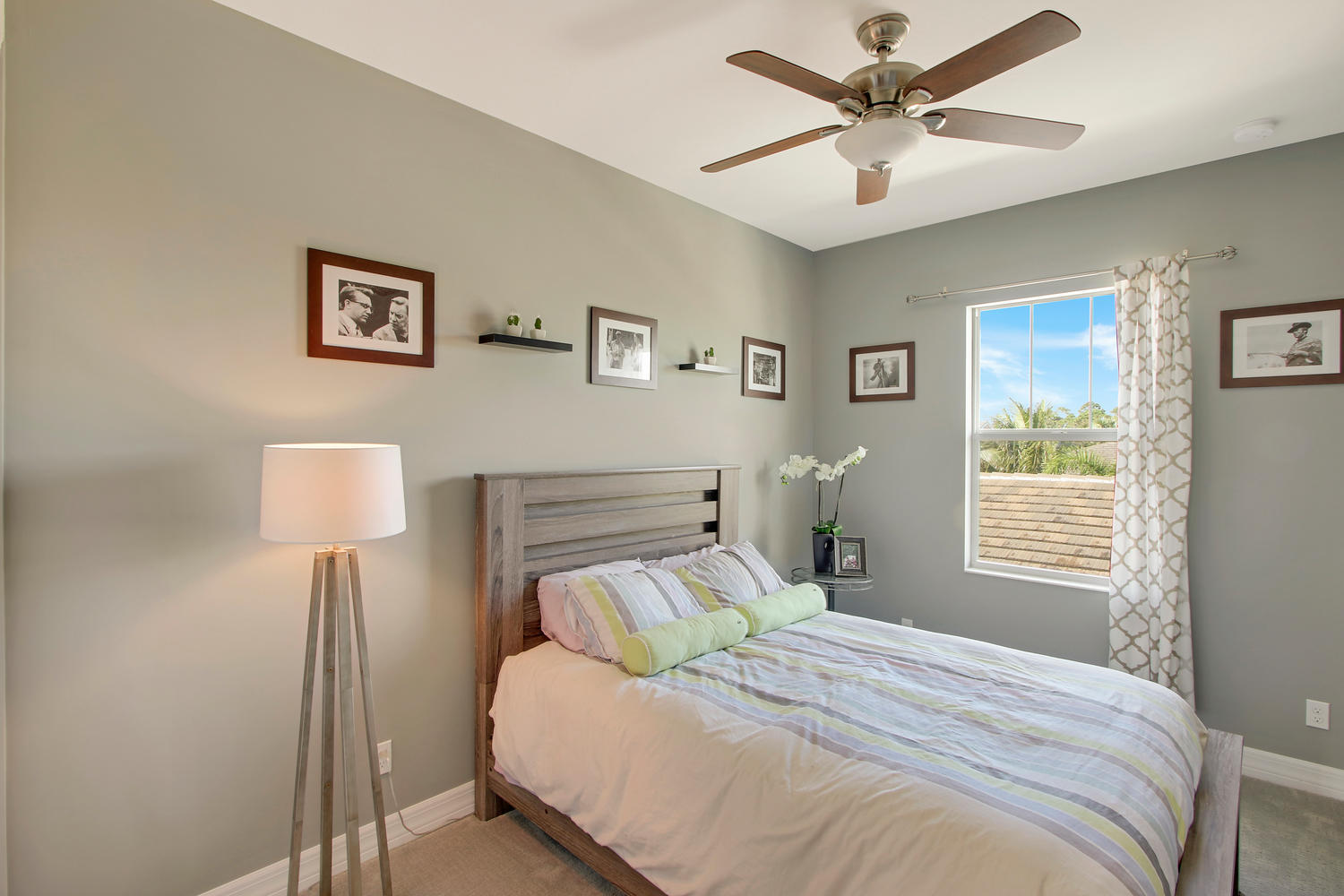 2706 Avalon Way Jupiter, FL 33458 - Photo 15 of 28 a bedroom with a bed and a window