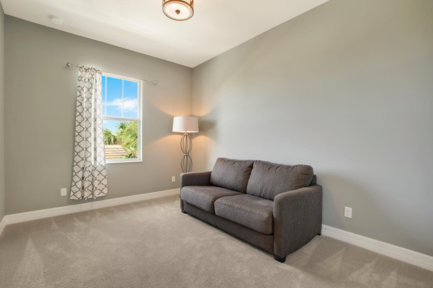 2706 Avalon Way Jupiter, FL 33458 - Photo 17 of 28 a living room with furniture and a window