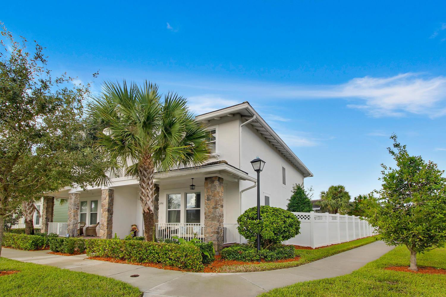 2706 Avalon Way Jupiter, FL 33458 - Photo 2 of 28 a front view of a house with a yard