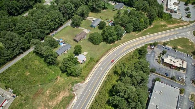 an aerial view of a residential houses with outdoor space