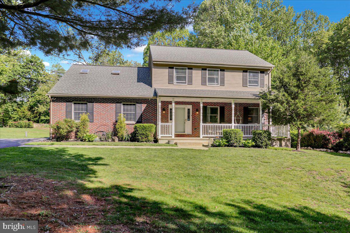 2581 Hill Road Reading, PA 19606 - Photo 1 of 53 a front view of a house with a garden