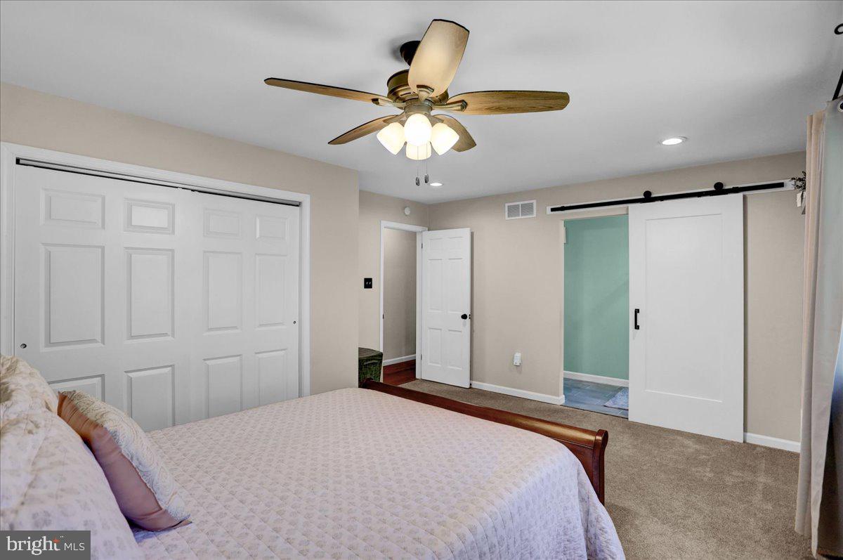 2581 Hill Road Reading, PA 19606 - Photo 33 of 53 a bedroom with a bed and a chandelier