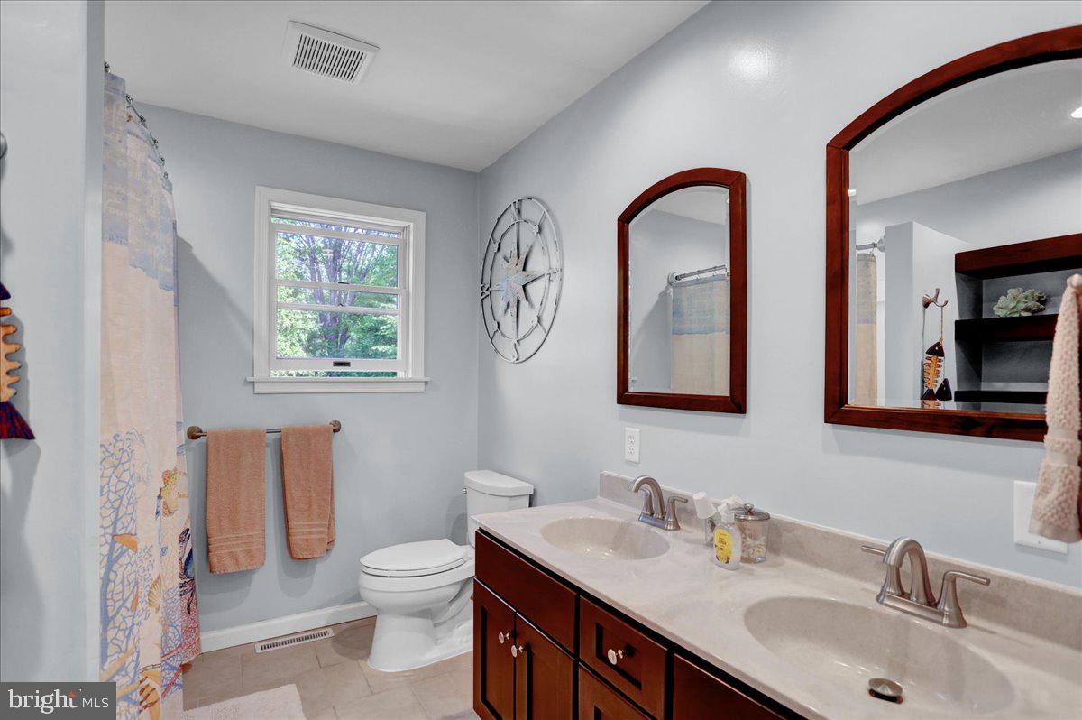 2581 Hill Road Reading, PA 19606 - Photo 39 of 53 a bathroom with a toilet a sink and mirror