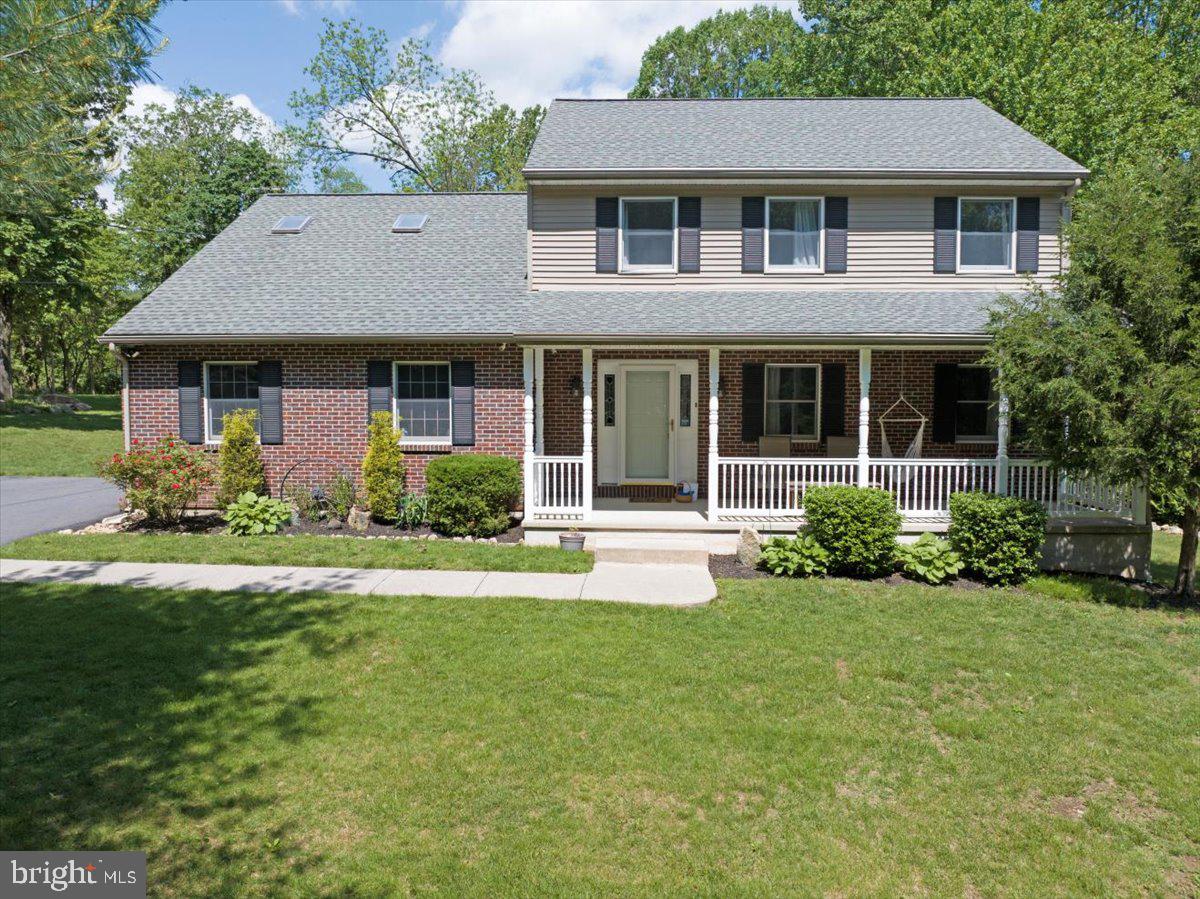 2581 Hill Road Reading, PA 19606 - Photo 4 of 53 a front view of a house with garden and porch