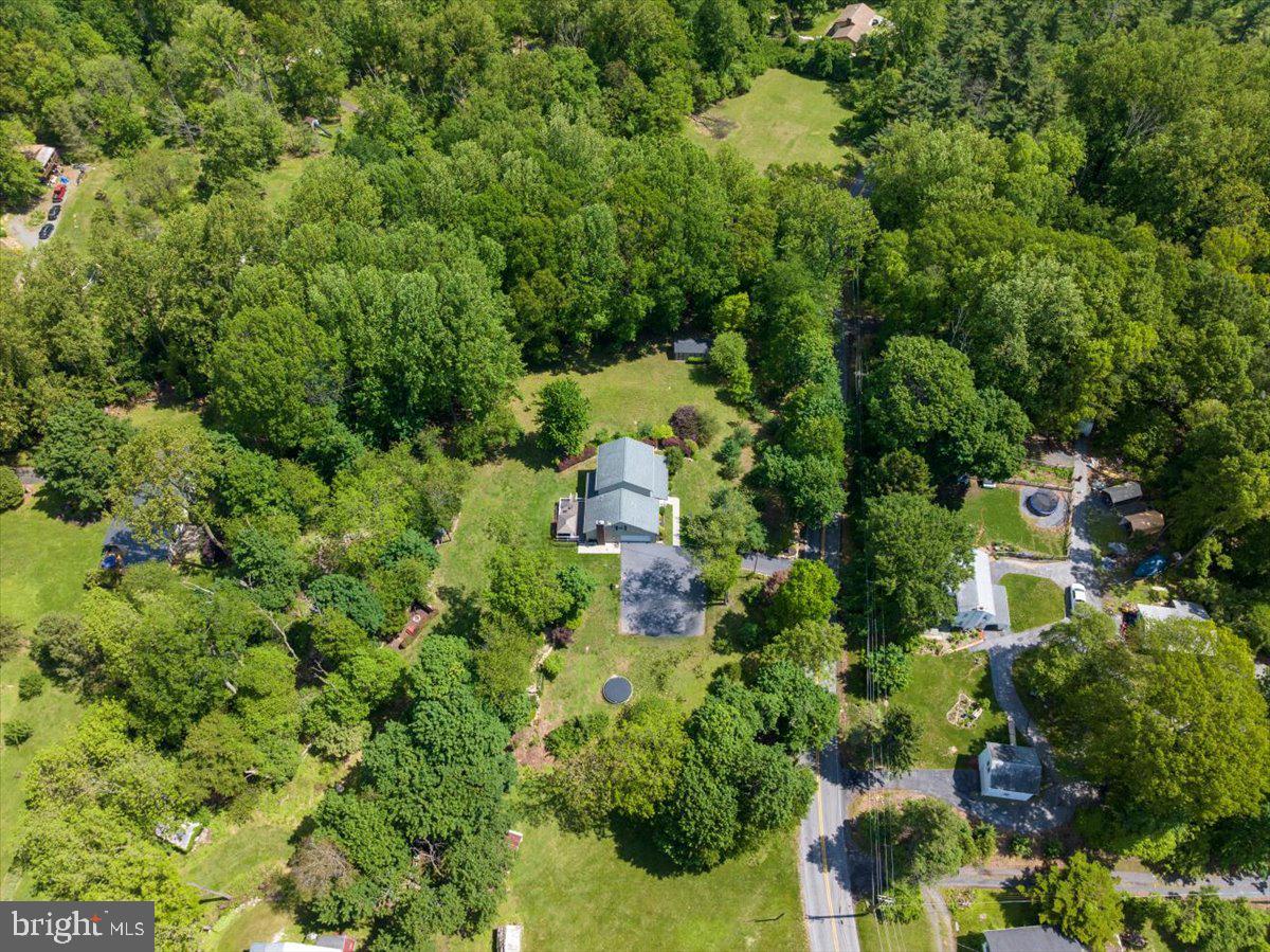 2581 Hill Road Reading, PA 19606 - Photo 50 of 53 an aerial view of a house with a yard and large trees