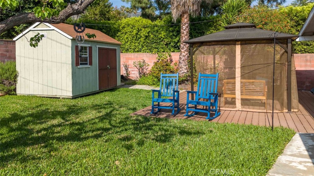 301 West Ashby Street Azusa, CA 91702 - Photo 17 of 75 a view of a small house with yard and sitting area