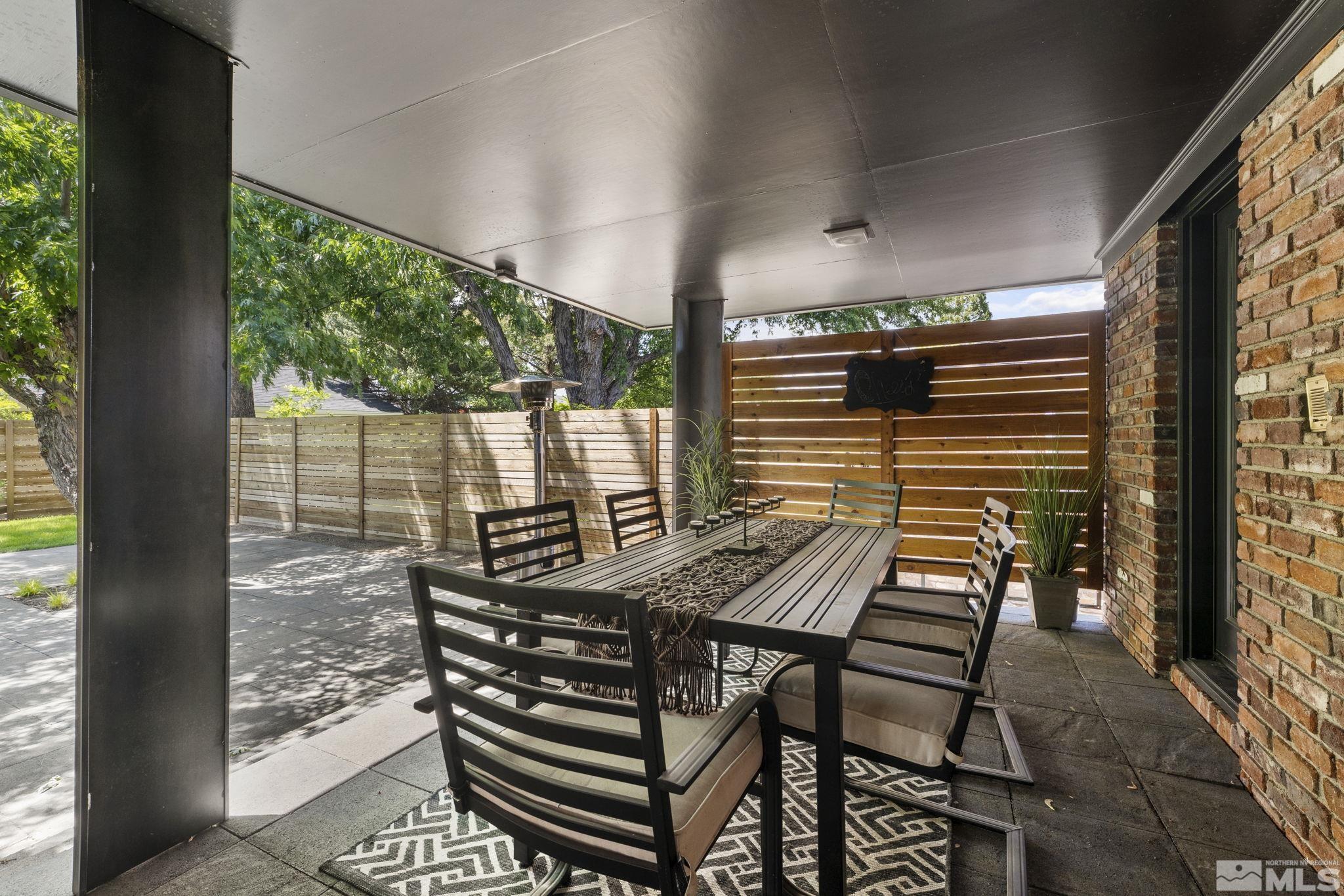 1085 Sharon Way Reno, NV 89509 - Photo 34 of 40 a view of a patio with table and chairs and wooden floor
