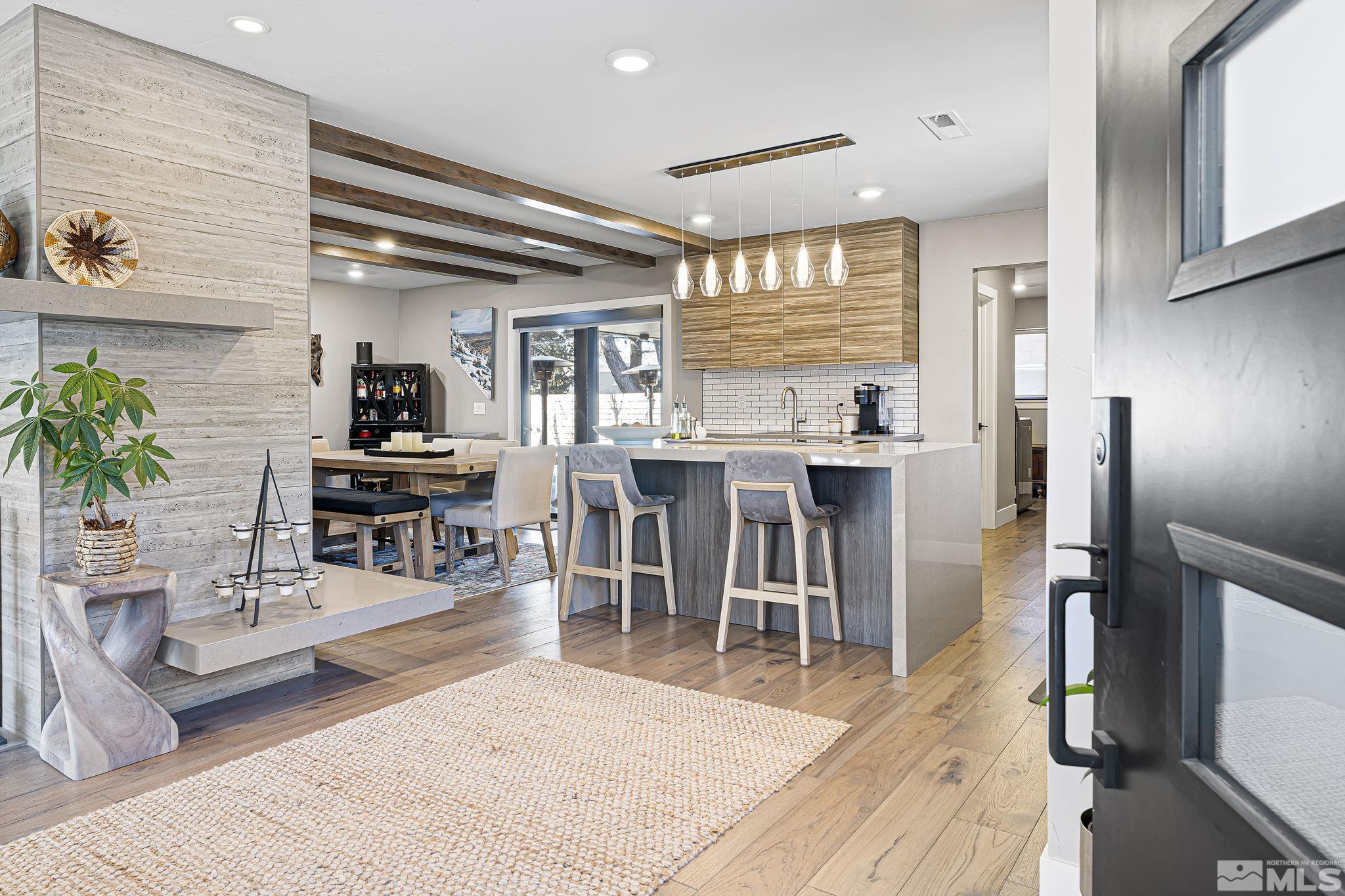 1085 Sharon Way Reno, NV 89509 - Photo 4 of 40 a living room with stainless steel appliances kitchen island granite countertop furniture and a dining table