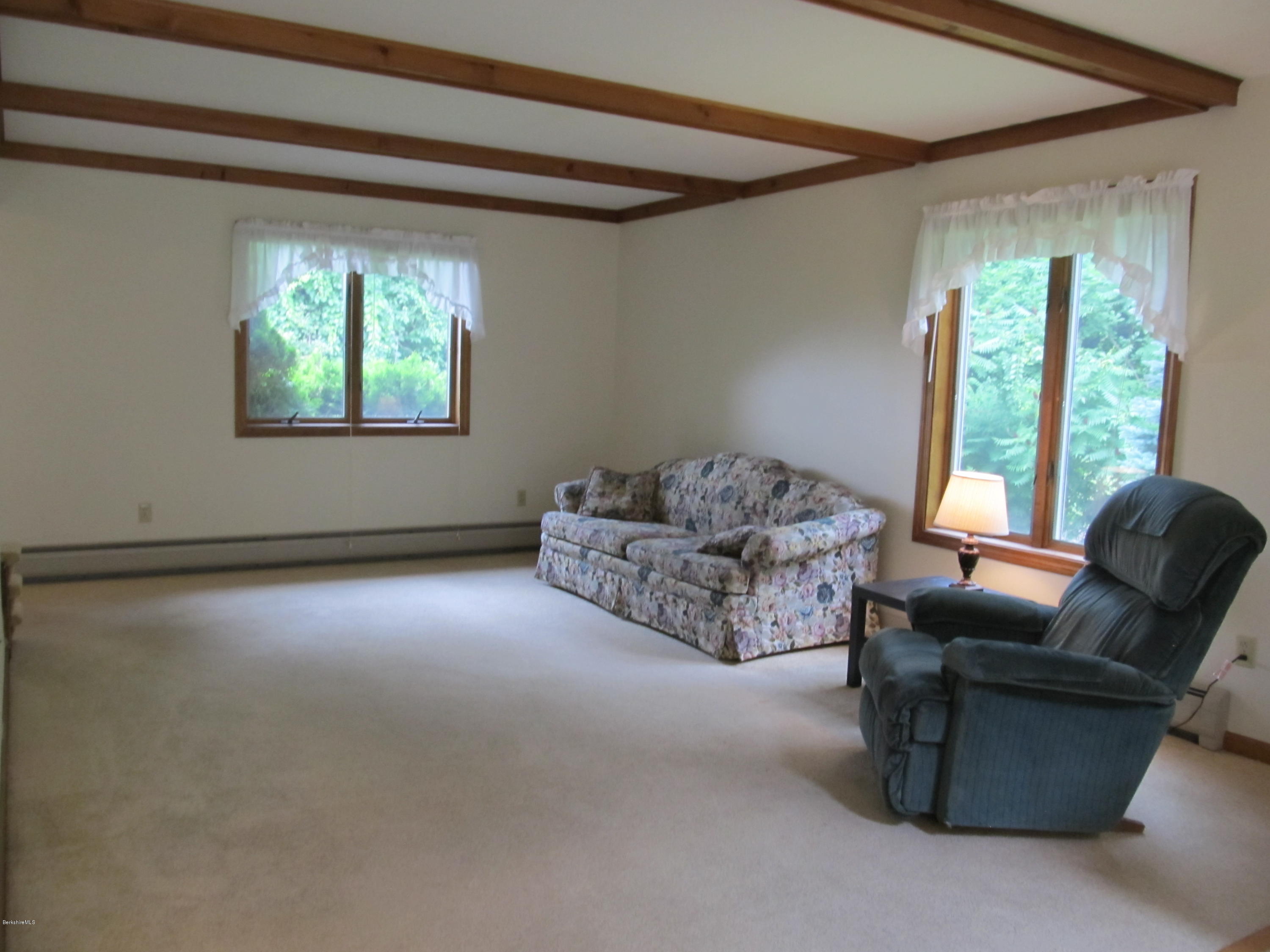 145 Maple Street, Unit 2 Lee, MA 01238 - Photo 14 of 16 a living room with furniture and a window