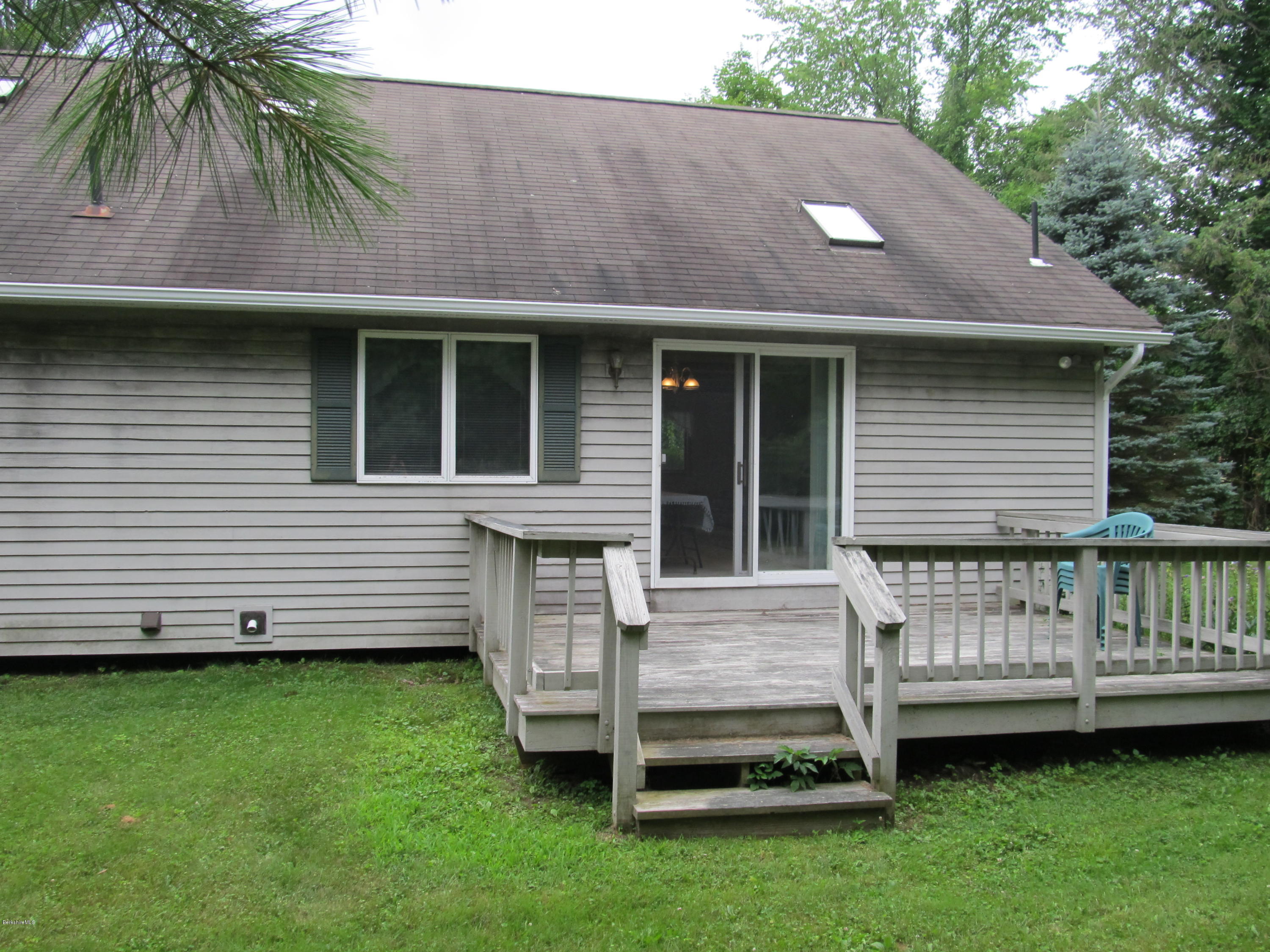 145 Maple Street, Unit 2 Lee, MA 01238 - Photo 8 of 16 a view of a house with a backyard