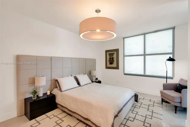 a bathroom with a sink mirror toilet and shower