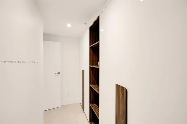 a view of a living room and kitchen