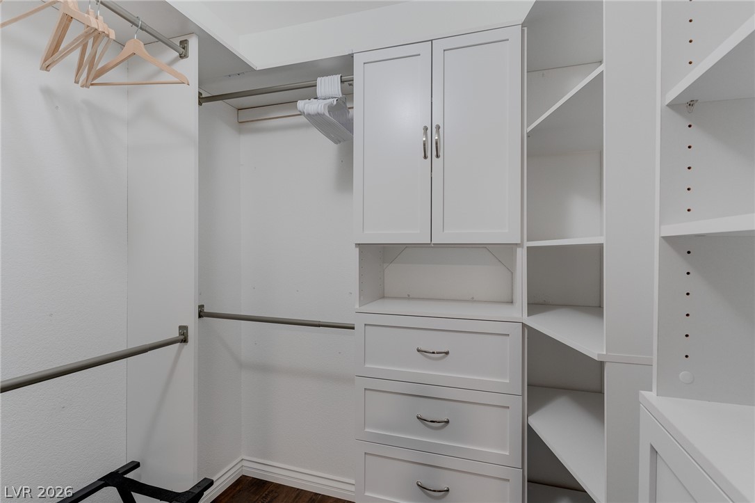 7255 West Sunset Road, Unit 2155 Las Vegas, NV 89113 - Photo 16 of 21 Walk in closet featuring dark wood-style flooring