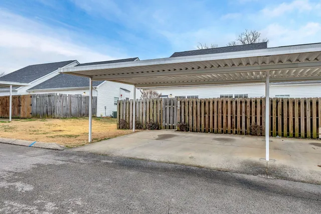 a view of a swimming pool with a outdoor seating
