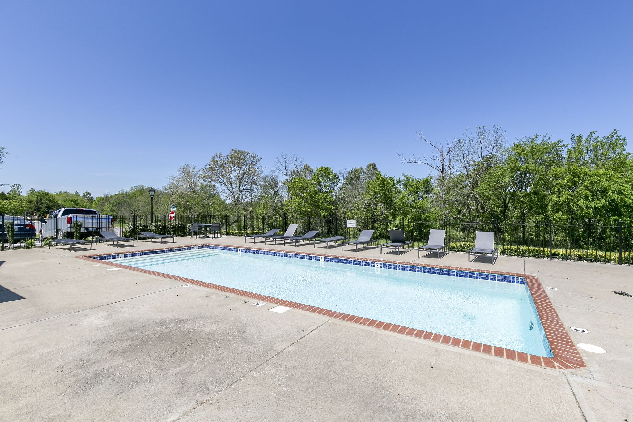 1019 Briggs Lane Spring Hill, TN 37174 - Photo 40 of 40 a view of a swimming pool and trees in the background