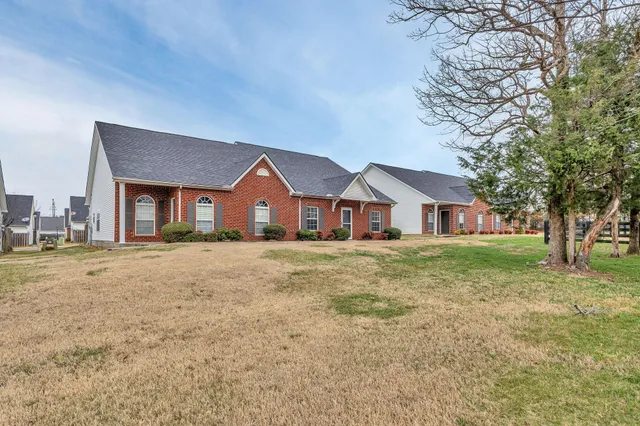 a front view of a house with a yard