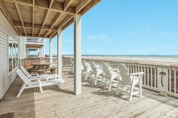 a view of a chairs and table on the deck