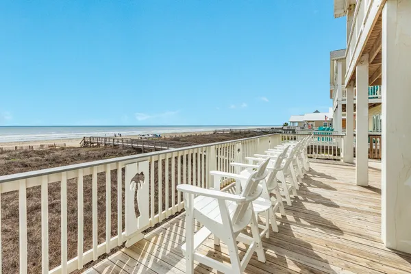 a view of a balcony with chairs