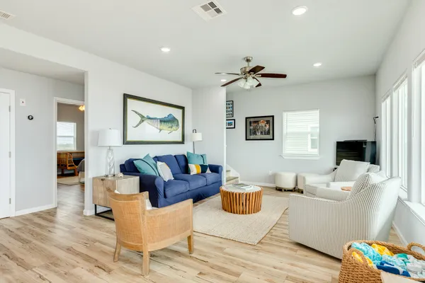 a living room with furniture or couch and a flat screen tv