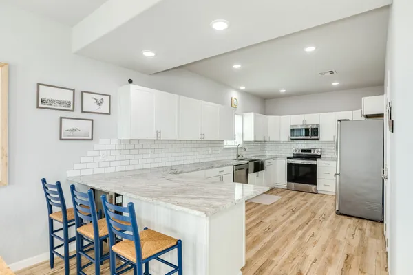 a kitchen with a table and chairs in it