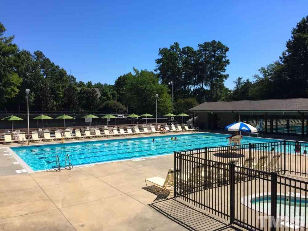 2908 Englefield Drive Raleigh, NC 27615 - Photo 14 of 16 a view of a swimming pool and a yard