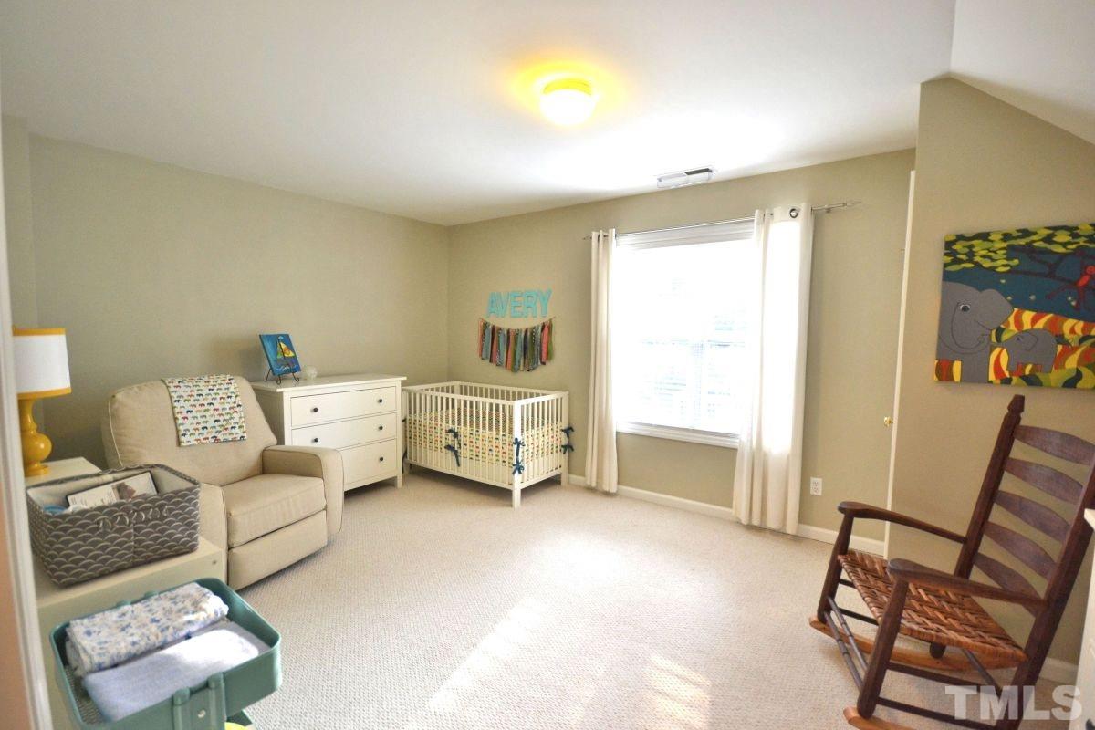 2908 Englefield Drive Raleigh, NC 27615 - Photo 8 of 16 a bedroom with furniture and a window