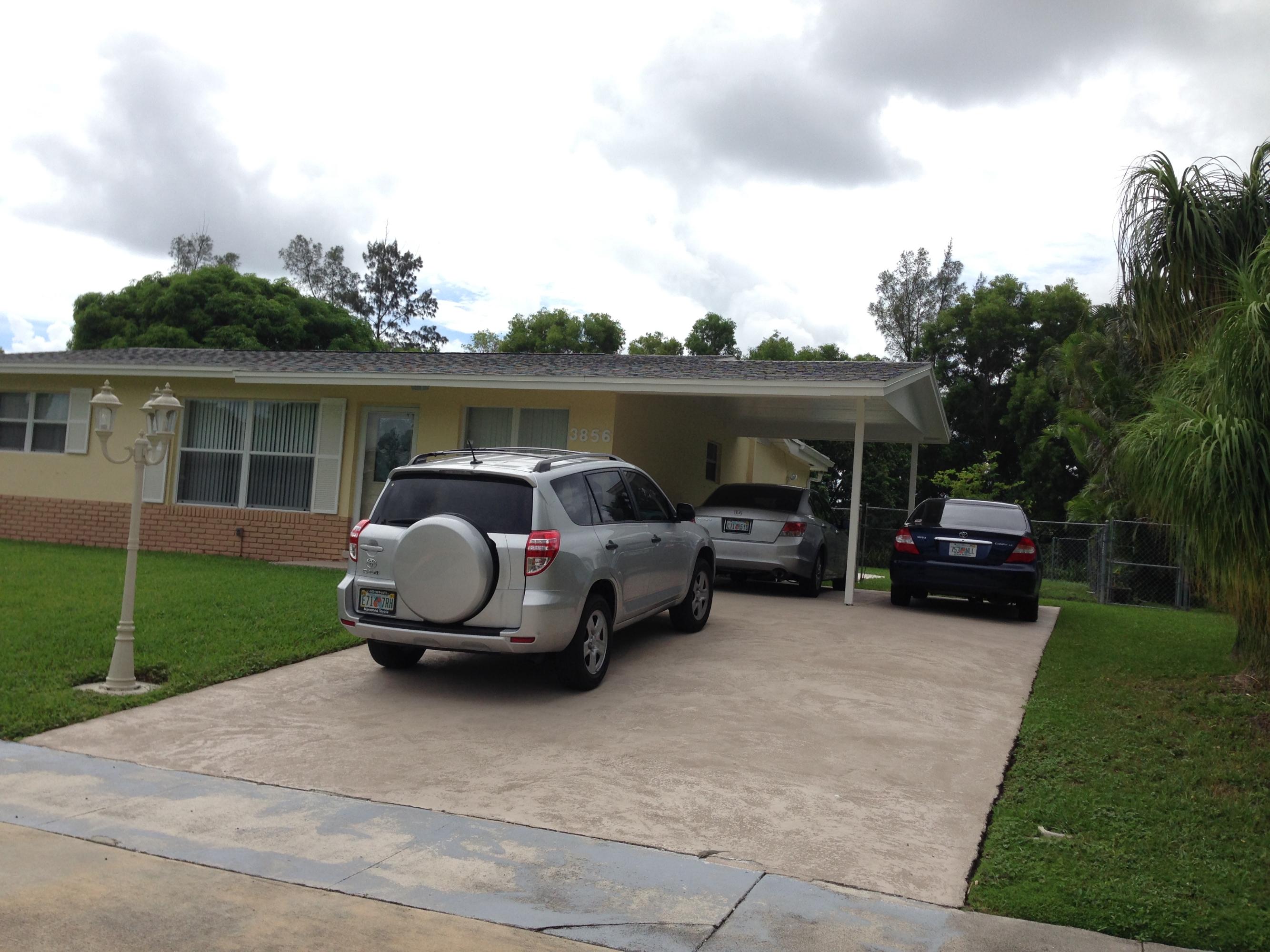 3856 Kewanee Road Lake Worth, FL 33462 - Photo 3 of 11 Carport and driveway
