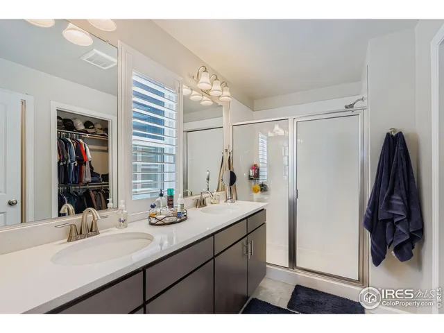 a bathroom with a sink vanity and a mirror
