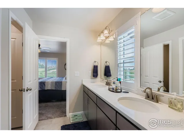 a bathroom with a sink double vanity and a mirror