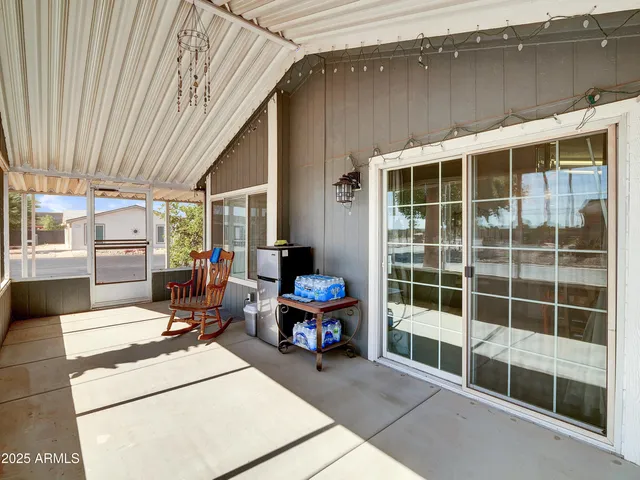 a view of a patio with table and chairs and potted plants