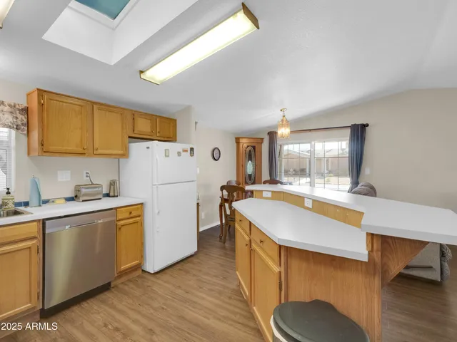 a kitchen that has a sink and a stove in it