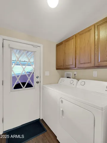 a view of storage and utility room with washer and dryer
