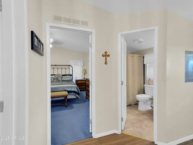 a view of a bedroom from a hallway