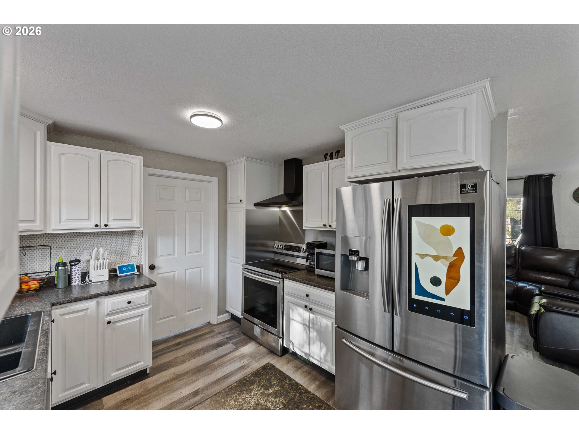 1643 Shelley Road Coquille, OR 97423 - Photo 11 of 39 a kitchen with stainless steel appliances granite countertop a refrigerator a stove and a sink