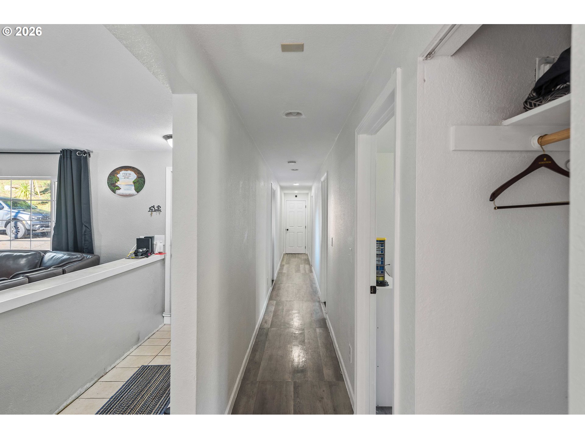 1643 Shelley Road Coquille, OR 97423 - Photo 13 of 39 a view of a hallway with wooden floor and staircase