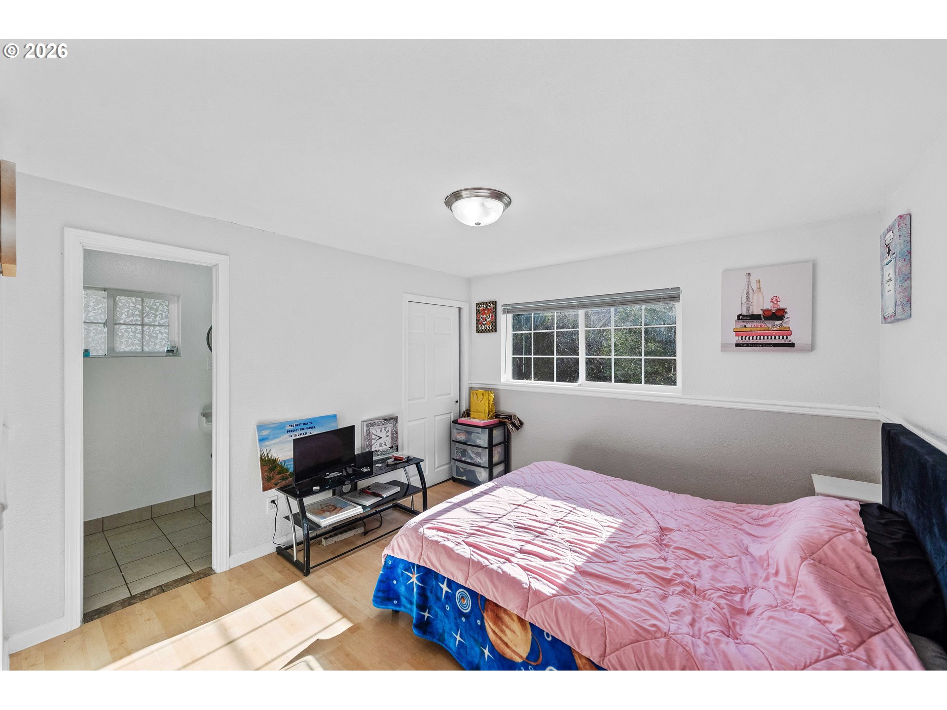 1643 Shelley Road Coquille, OR 97423 - Photo 22 of 39 a bedroom with a bed a window and dresser