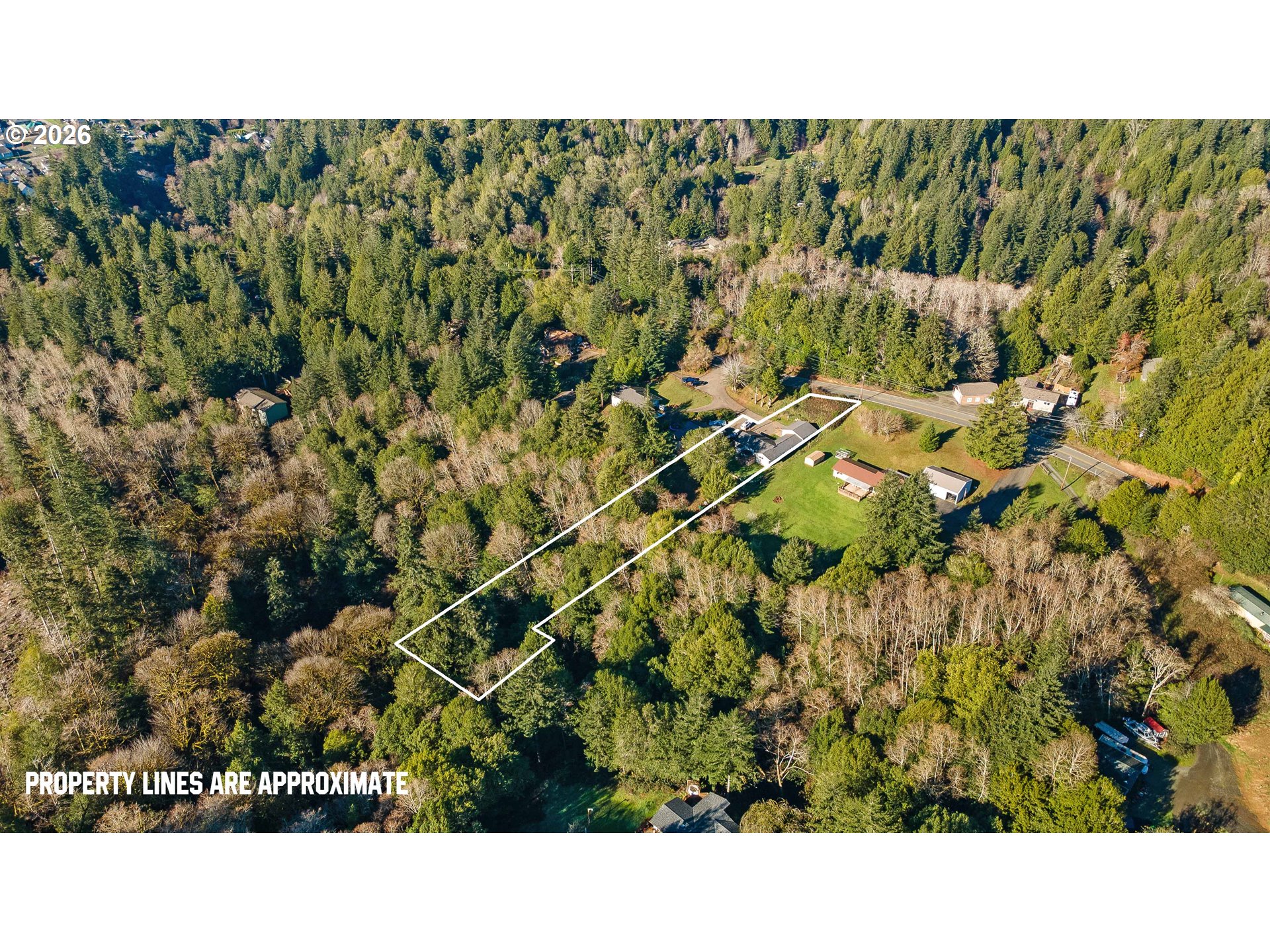 1643 Shelley Road Coquille, OR 97423 - Photo 38 of 39 a open area with a bench and trees