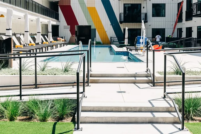 a view of parking garage with cars